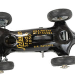 Vintage toy car with 'Schuco' branding and patent details on a white background