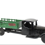 Model of a vintage truck with a green bed on a white background