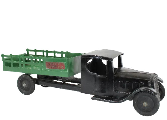 Model of a vintage truck with a green bed on a white background
