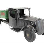 Vintage toy truck with a green bed on a white background