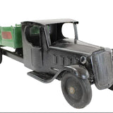 Vintage toy truck with a green bed on a white background