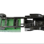 Model car chassis with green base and black components on a white background