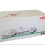 Model car packaging box with a race car illustration and Marklin branding on a dark background