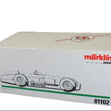 Model car box with Marklin logo and race car illustration on a dark background