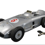 Model of a vintage Mercedes-Benz racing car with number 6 on a dark background