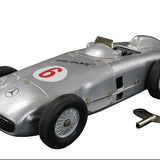 Model of a vintage Mercedes-Benz racing car with number 6 on a dark background