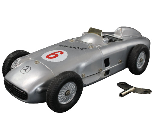 Model of a vintage Mercedes-Benz racing car with number 6 on a dark background