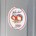 Colorful sticker with number '80' on a metallic surface