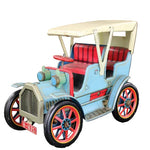 Model of a Model T car with a beige roof and red interior on a gray background