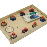 Vintage-style game board with inkwell-like objects on a white background