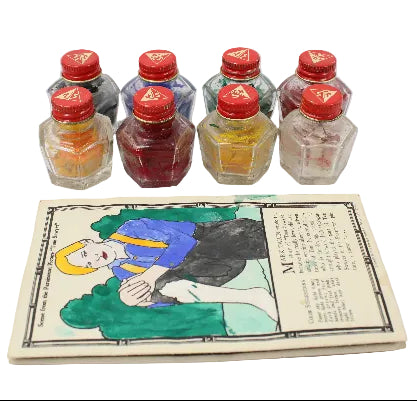 Set of small bottles with red caps and a colorful illustration on a white background