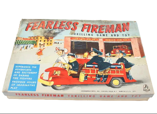 Vintage 'Fearless Fireman' game and toy box on a white background