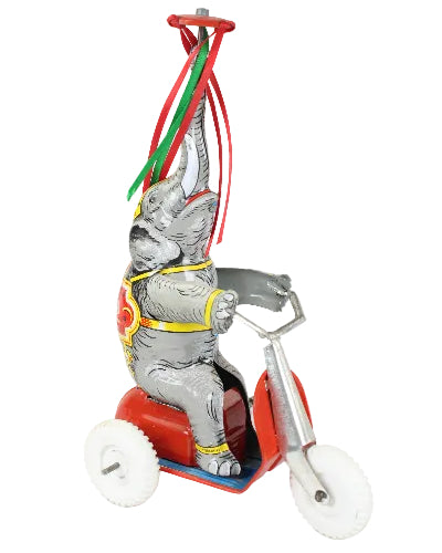 Toy elephant with a rider on a white background