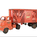 Vintage toy truck with a red trailer on a white background