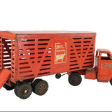 Red toy truck with a trailer on a white background