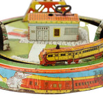 Vintage toy train set with colorful track and buildings on a white background