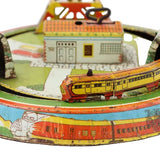 Vintage toy train set with colorful track and buildings on a white background