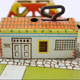 Toy house with 'Glendale' branding on a board game