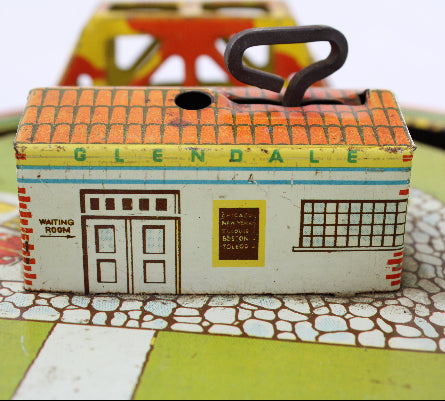 Toy house with 'Glendale' branding on a board game