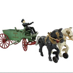 Toy figure of a man in a green cart pulled by two horses on a white background