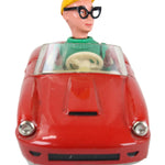 Toy figure of a character with a red vehicle body on a white background