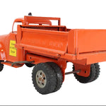 Orange toy truck with a flatbed on a white background