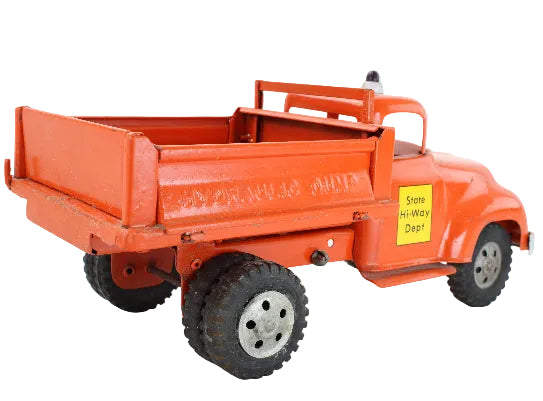 Model of an orange dump truck with a yellow sign on a white background