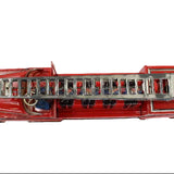 Red toy fire truck with a ladder on a white background