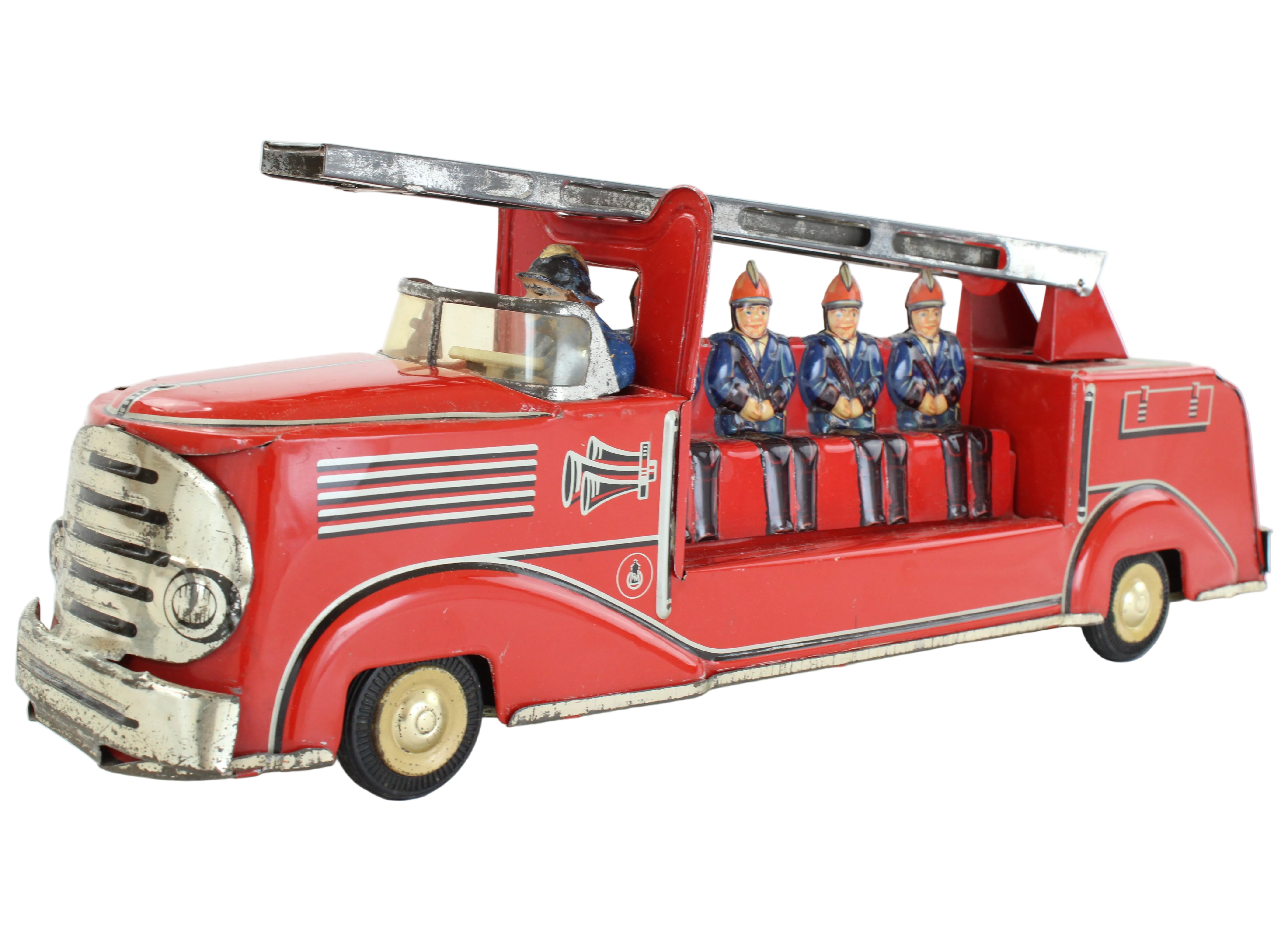 Red toy fire truck with ladder and figurines on a white background