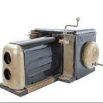Vintage camera with a metallic finish on a white background