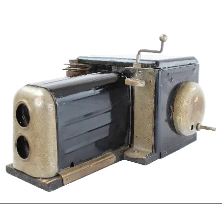 Vintage camera with a metallic finish on a white background