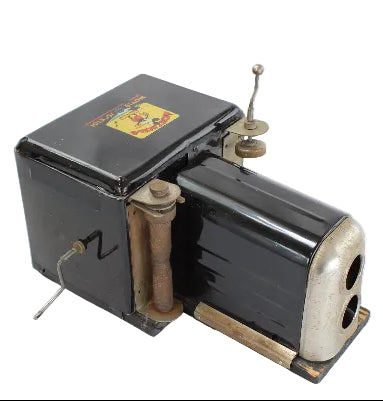 Vintage black and silver projector on a white background