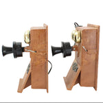 Pair of wooden bookend telephones on a white background