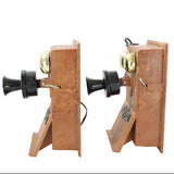 Pair of wooden bookend telephones on a white background
