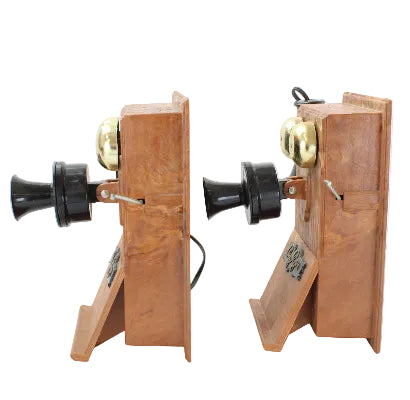 Pair of wooden bookend telephones on a white background