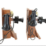 Two vintage-style telephones with wooden bases and black mechanical parts on a white background.