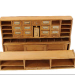 Wooden storage unit with multiple compartments on a white background