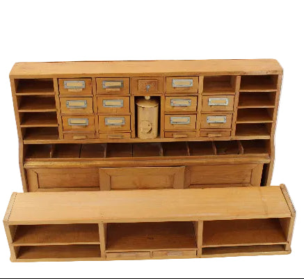 Wooden storage unit with multiple compartments on a white background