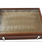 Wooden box with glass top displaying 'Homeopathic Humphreys' Remedies' on a white background