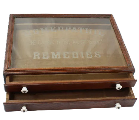 Wooden display case with glass top on a white background