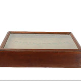 Wooden display box with glass lid on a white background