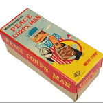 Box for a mechanical toy 'Peace Corps Man' with colorful design on a white background