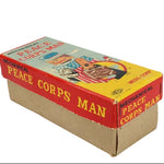 Vintage box for a mechanical Peace Corps Man toy on a white background