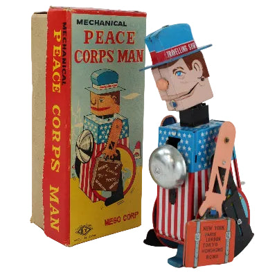 Mechanical Peace Corps Man toy with its box on a white background