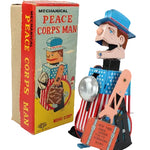 Vintage toy 'Peace Corps Man' with original box on a white background