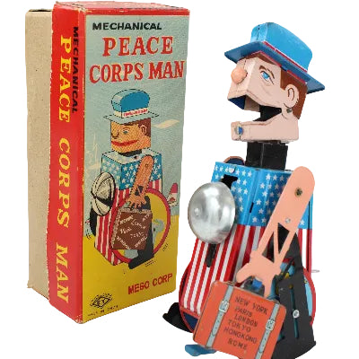 Vintage toy 'Peace Corps Man' with original box on a white background