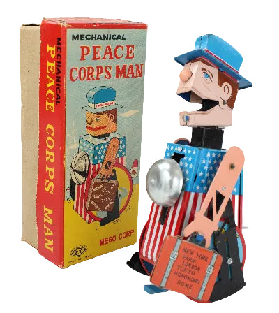Vintage toy 'Peace Corps Man' with original box on a white background
