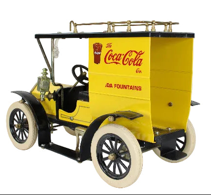 Model of a vintage car with Coca-Cola branding on a white background