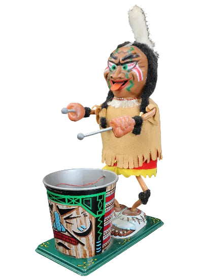 Colorful Native American dancer puppet with a cup and ball on a dark background