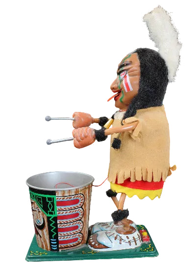 Traditional Native American puppet with headdress and drum on a dark background